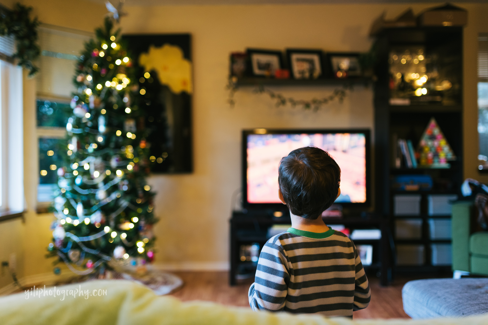 Seattle little boy looking at video game on television