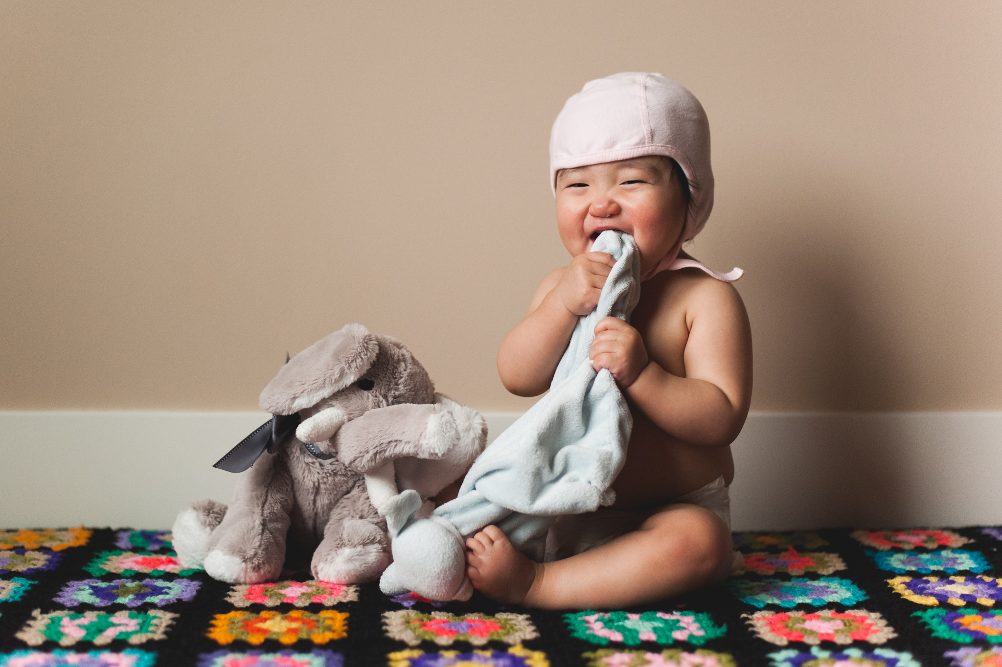 Seattle baby photographer, baby hat, stuffed elephant