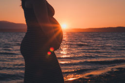 maternity photo featuring sunset on the beach, by Yi Li photography