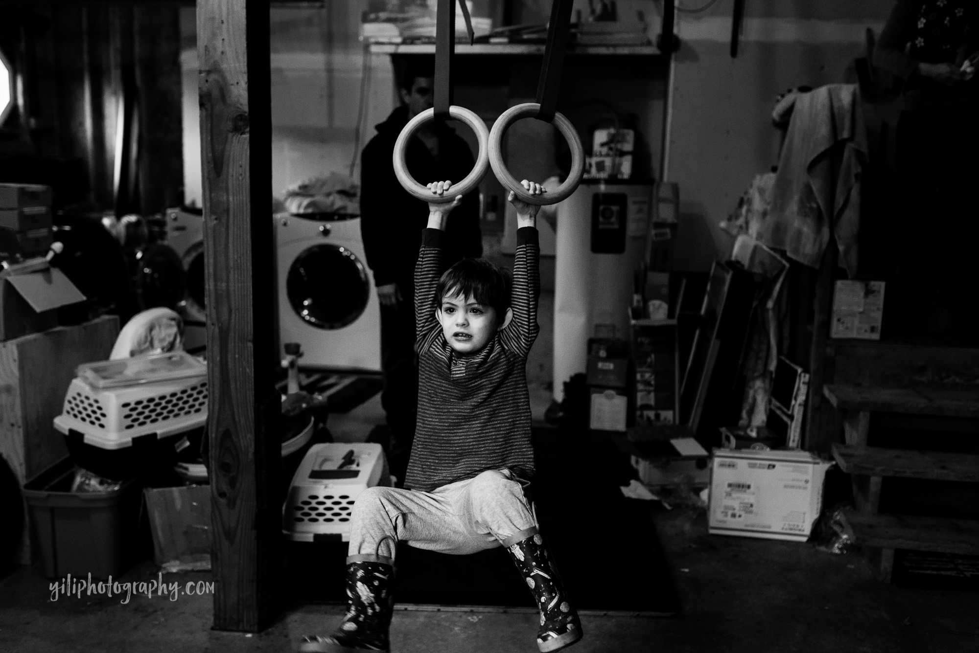 seattle toddler swinging on gymnastics rings