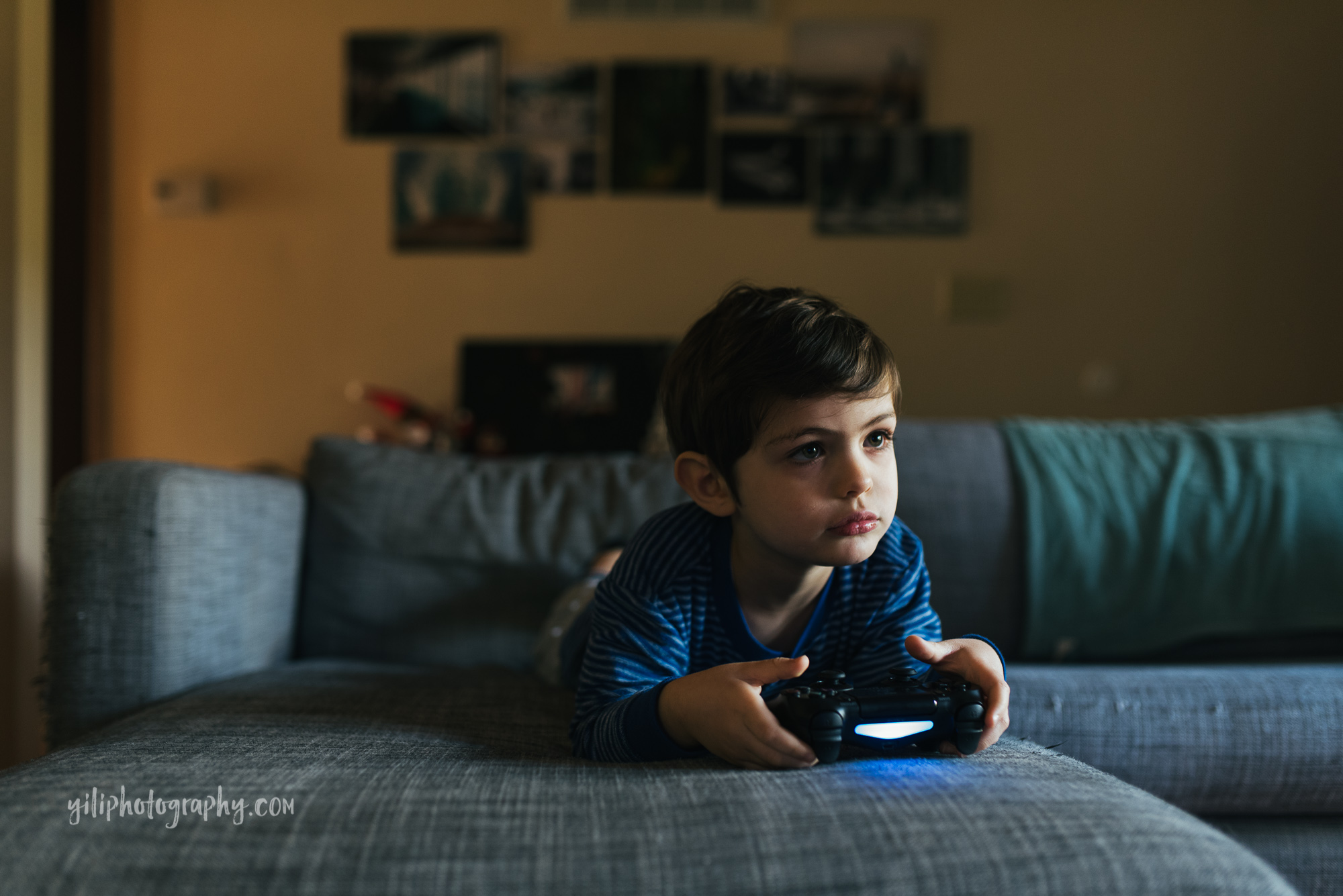 seattle toddler holding video game controller
