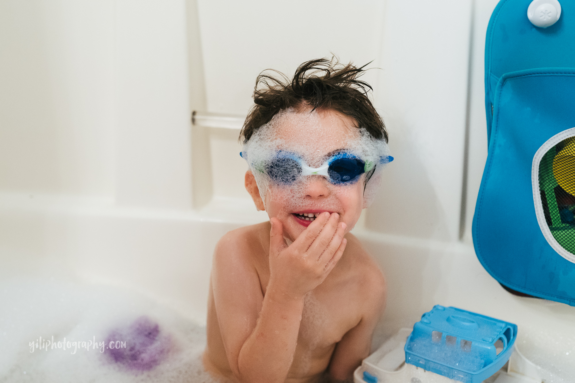 seattle toddler wearing goggles in bathtub