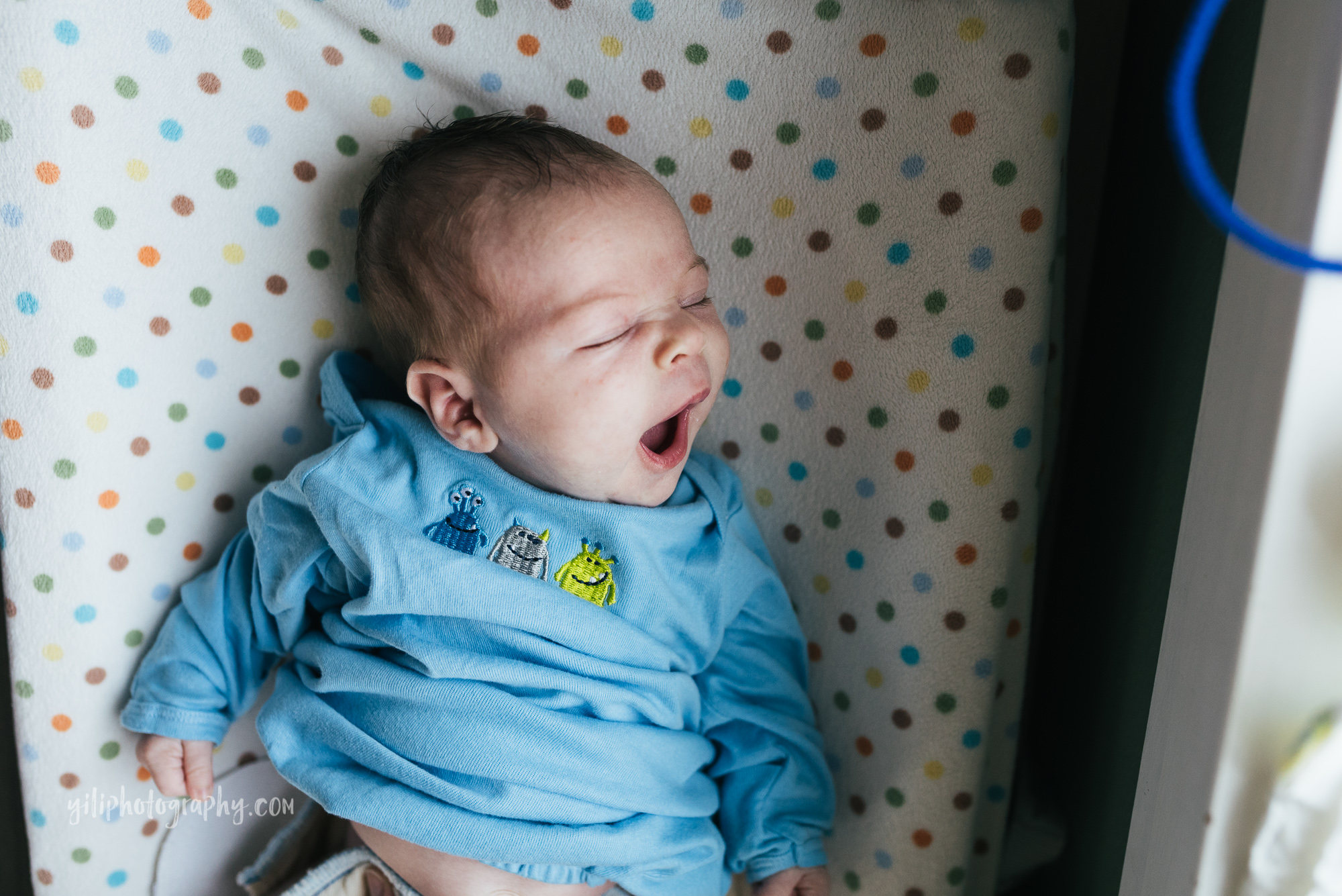 seattle newborn baby yawning on changing table