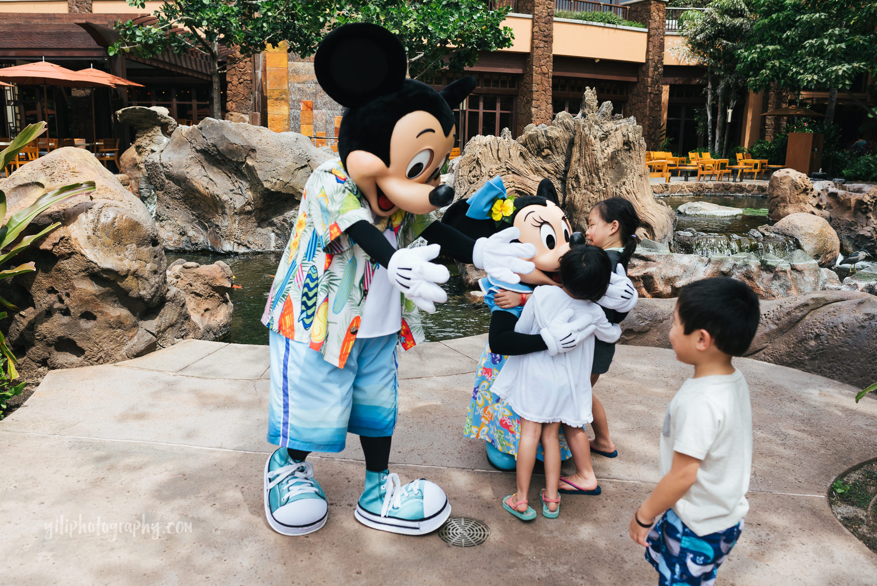 little boy meets mickey mouse at aulani