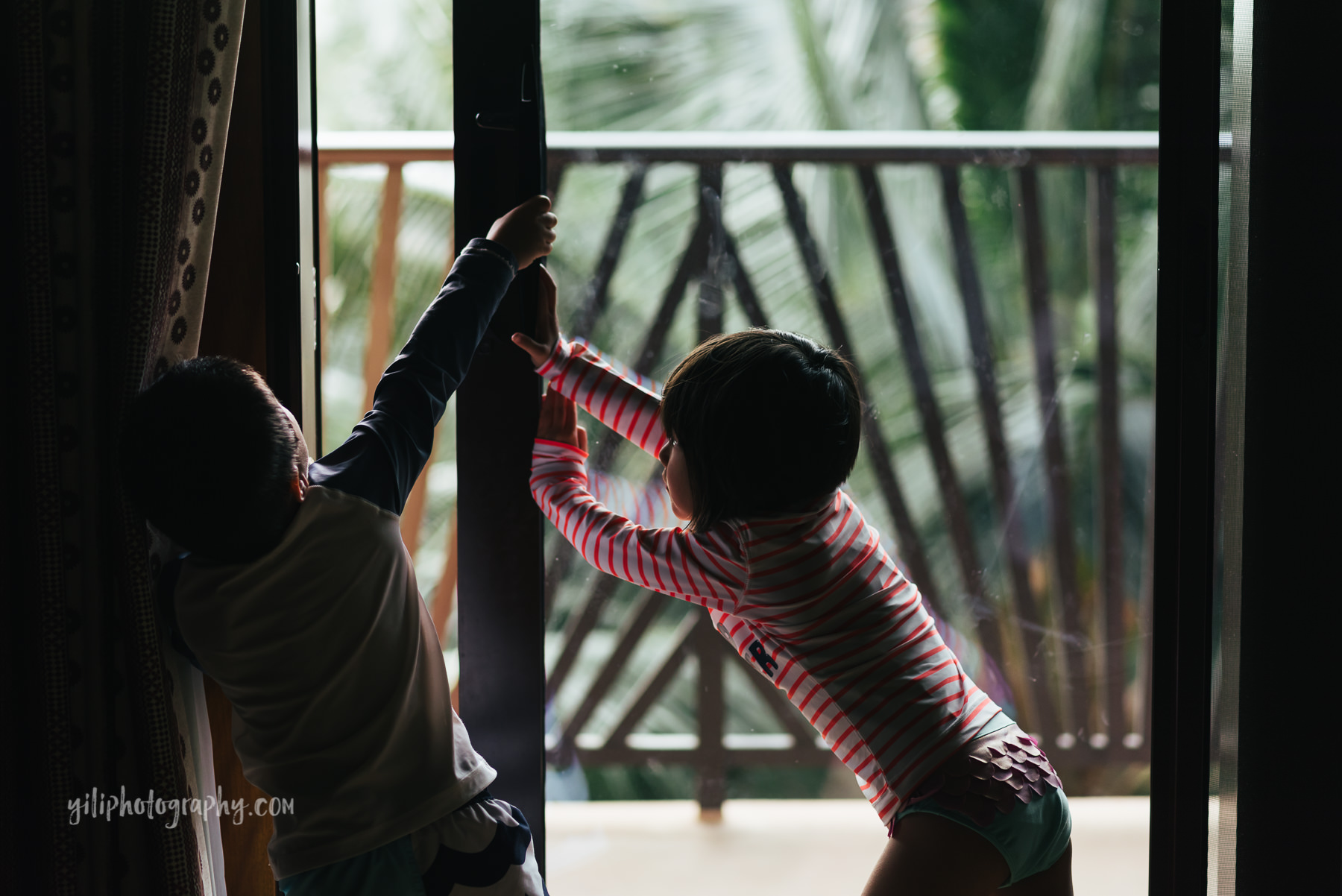 fraternal twins closing hotel sliding door