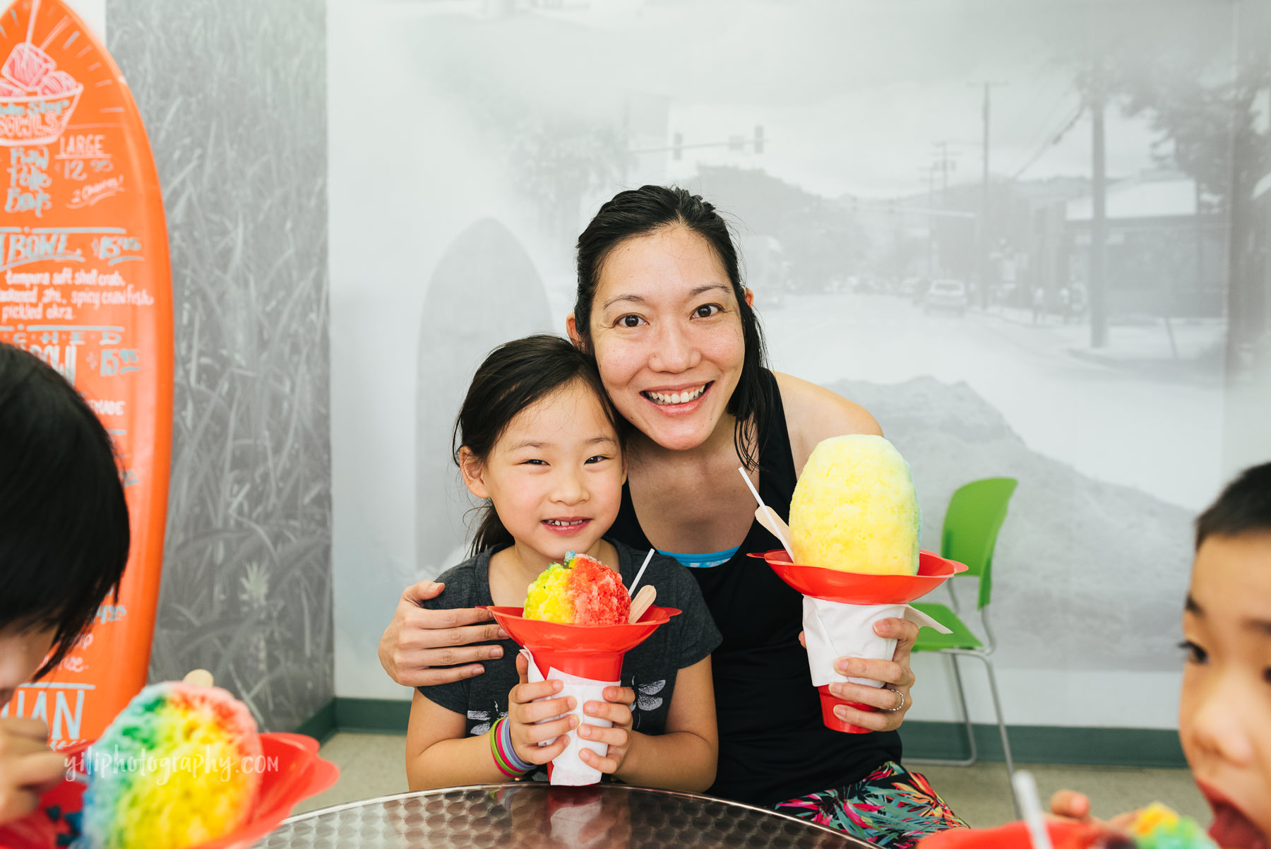 mom and daughter posing with shave ice