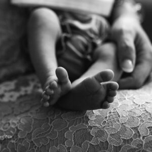 black and white close up of newborn baby toes