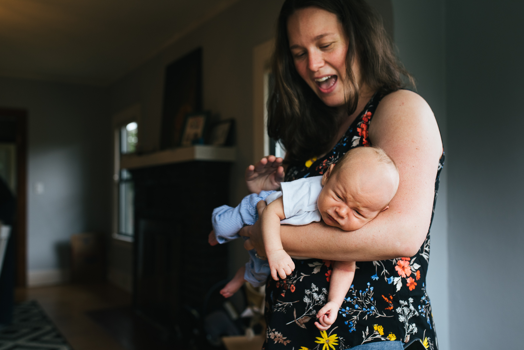 new mom patting baby boy on back to try to soothe him