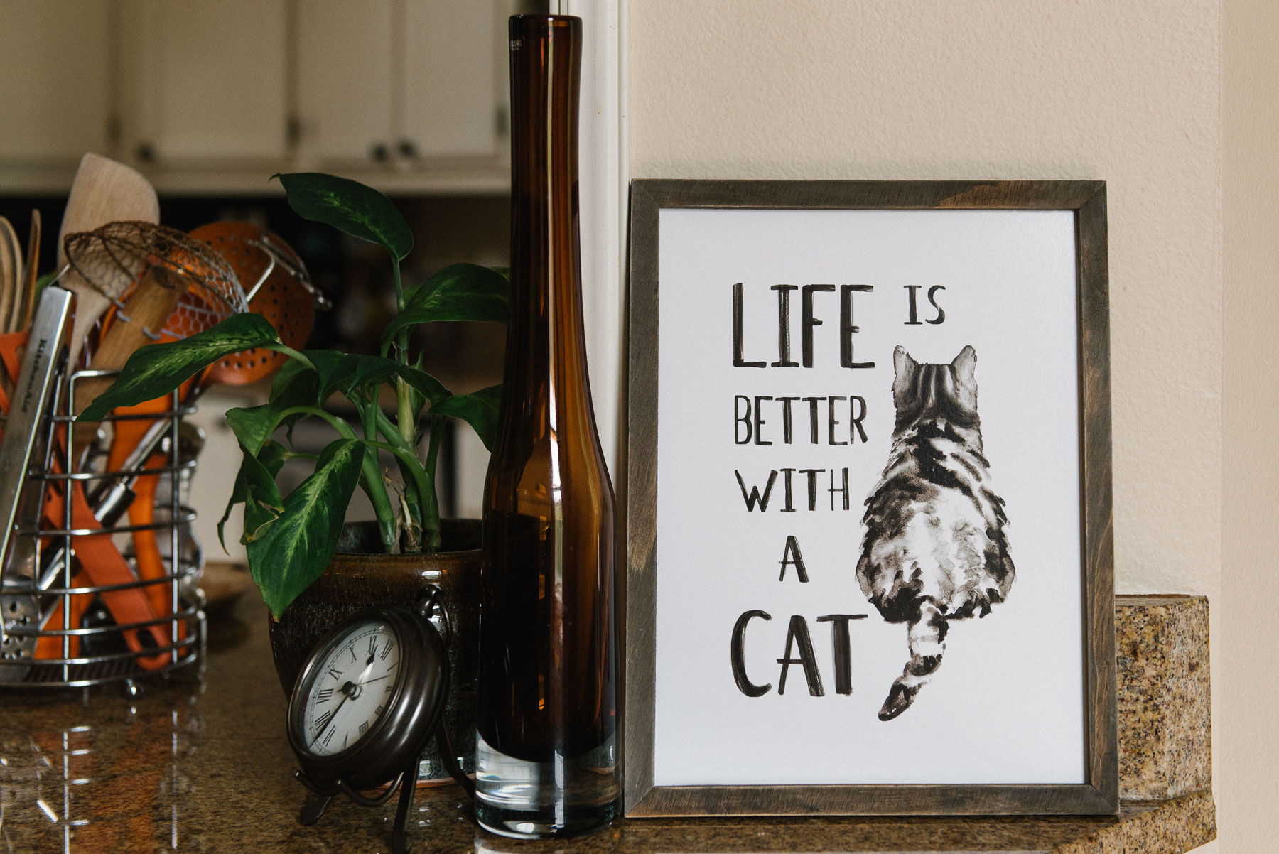 kitchen counter with cat lovers sign