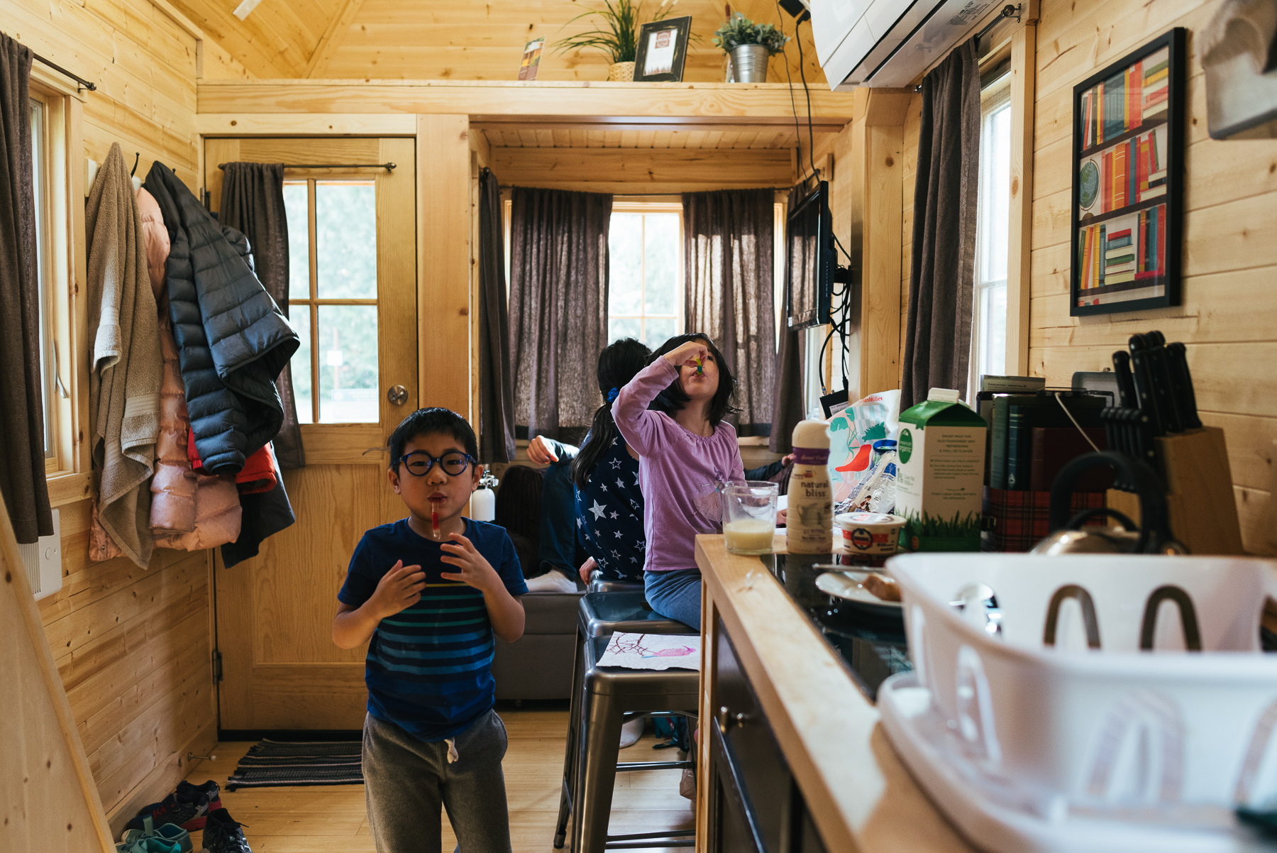 kids eating inside tiny house