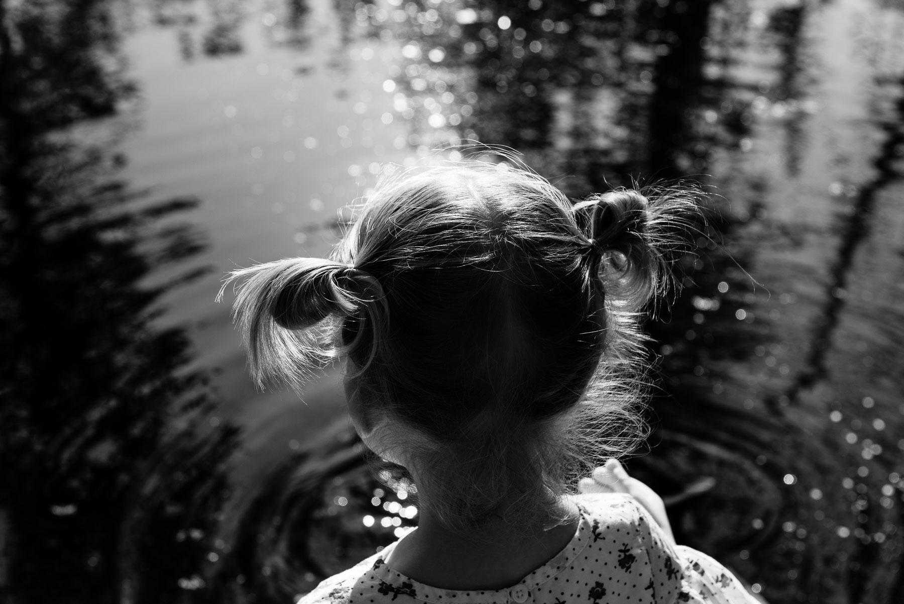 detail of little girl pigtails in sunlight