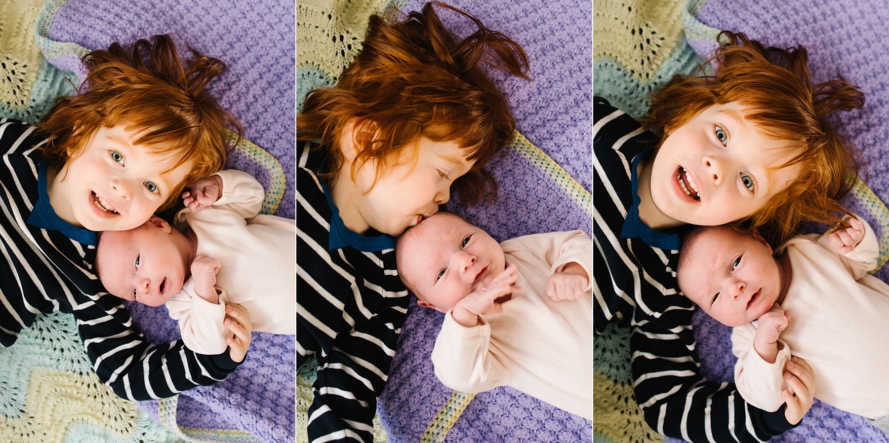 toddler brother laying with newborn baby sister on floor