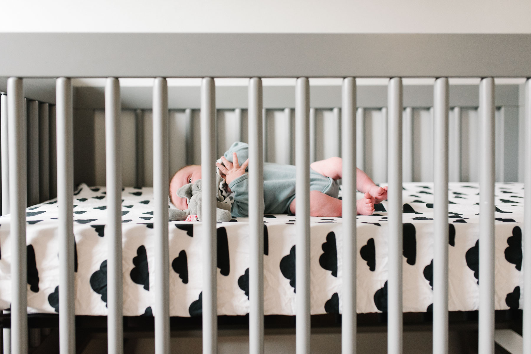 newborn baby boy in modern crib