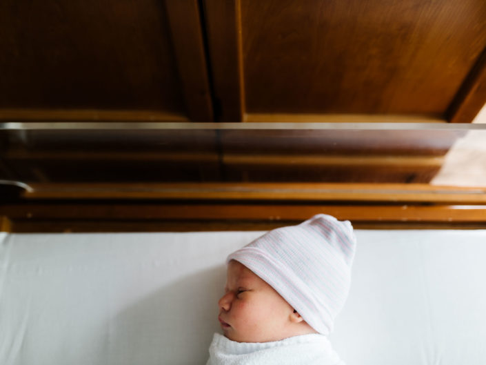 top down newborn baby in hospital bassinet