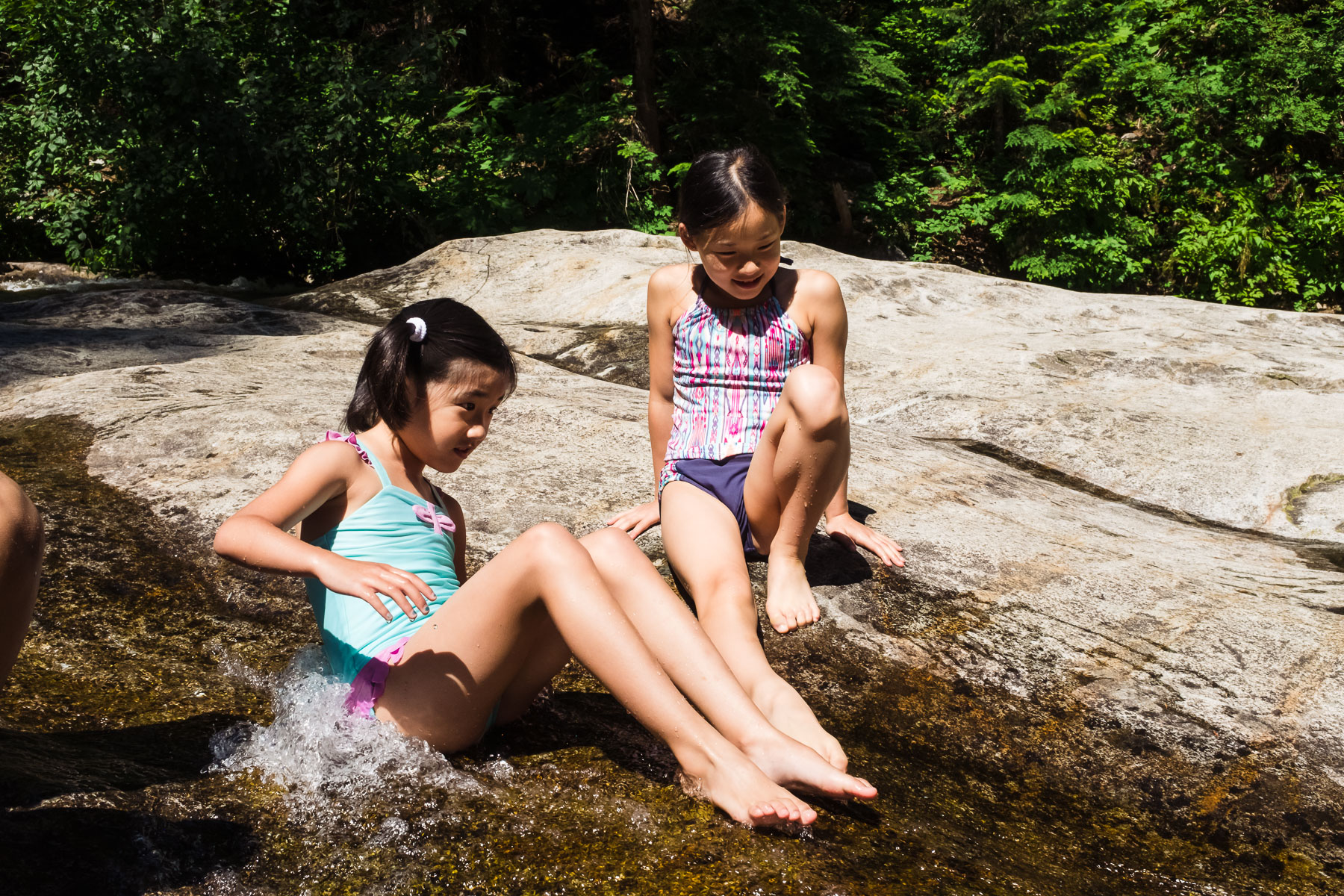 Two Asian girls at Denny Creek waterslide hike