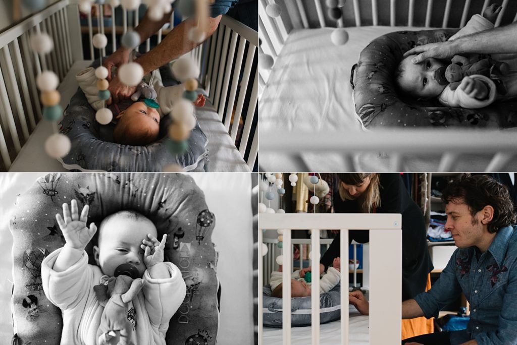 baby falling asleep in crib under mobile