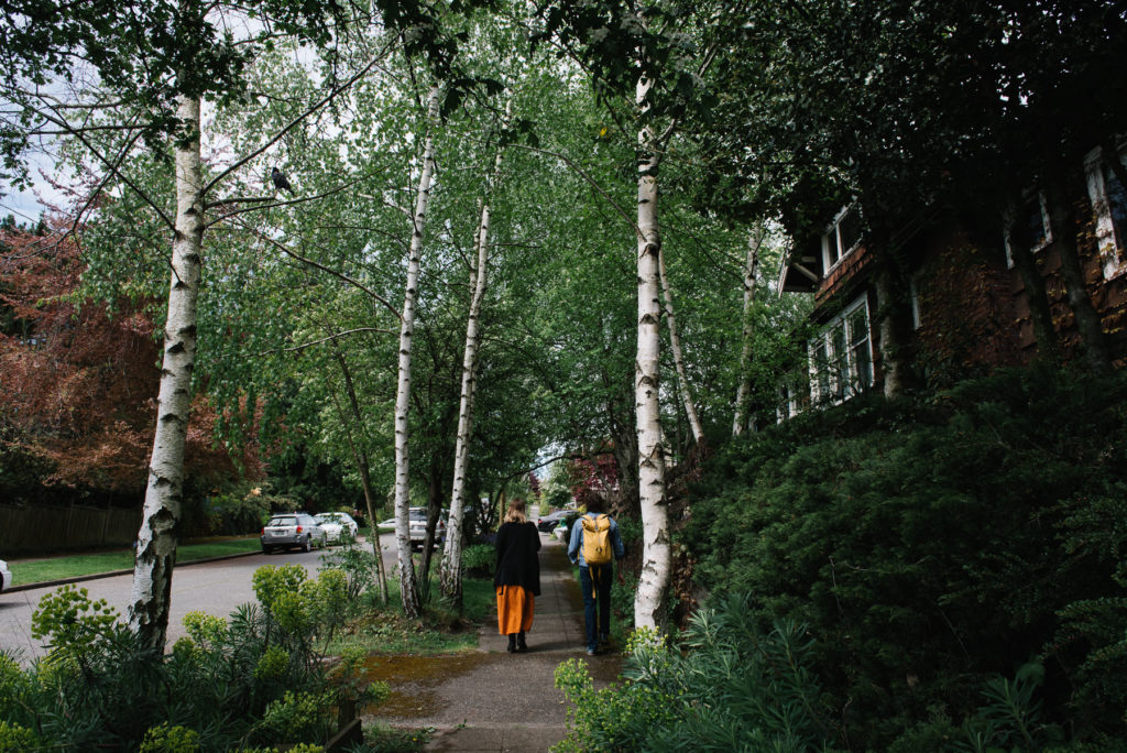 family walking through wooded neighborhood