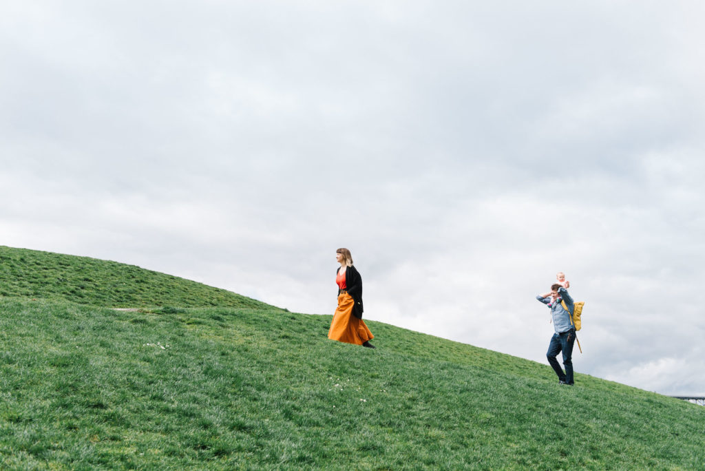 Family walking up kite hill at Gas Works Park