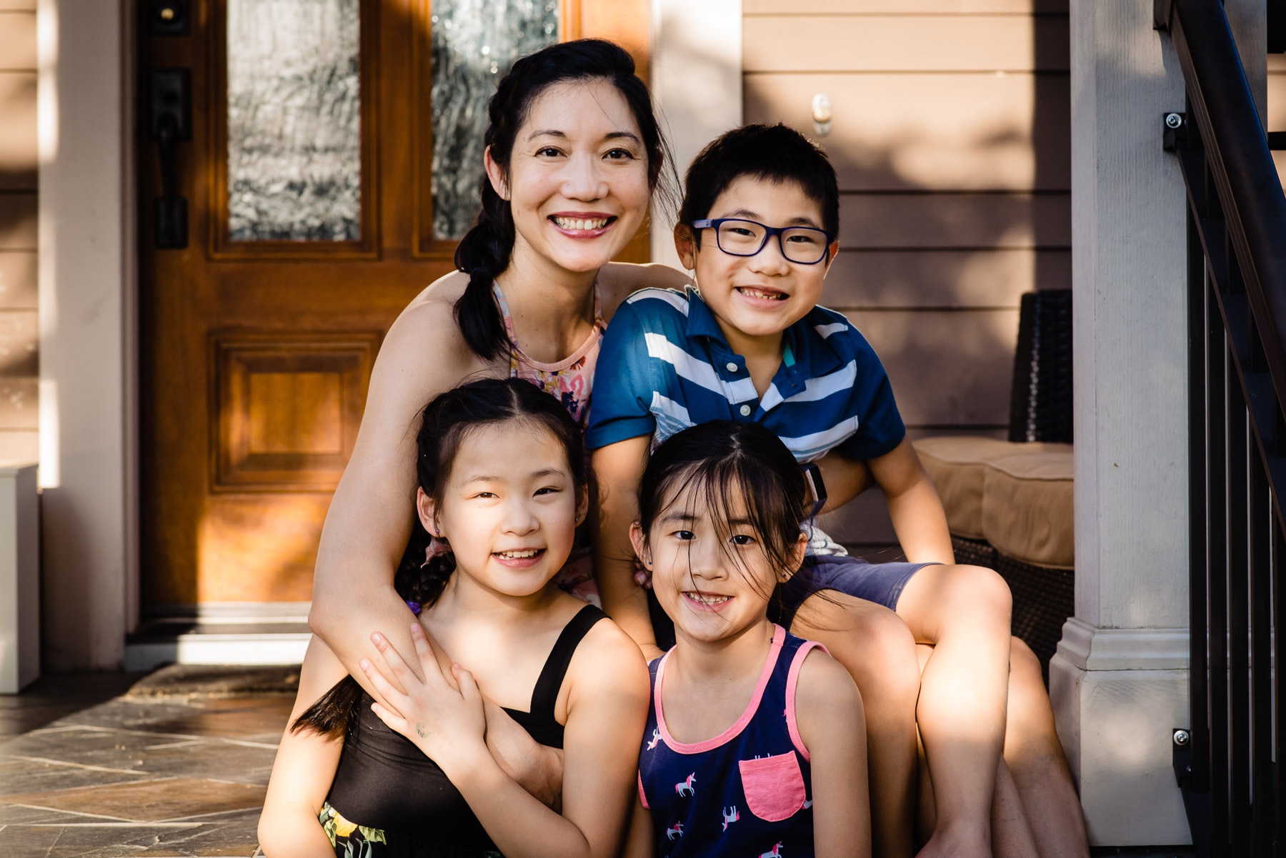 mother with three children on front porch